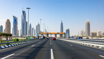 Dubai highway with modern toll gates and city skyline Dubai highway with modern toll gates and city skyline